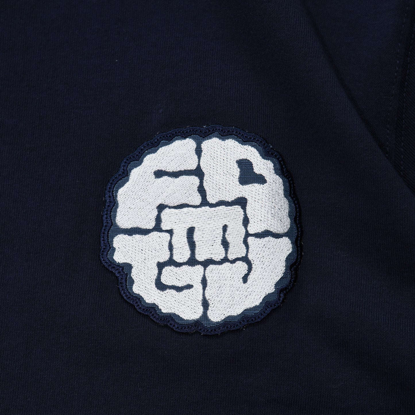 FDMTL FA24/TE33 CIRCLE PATCH TEE NAVY